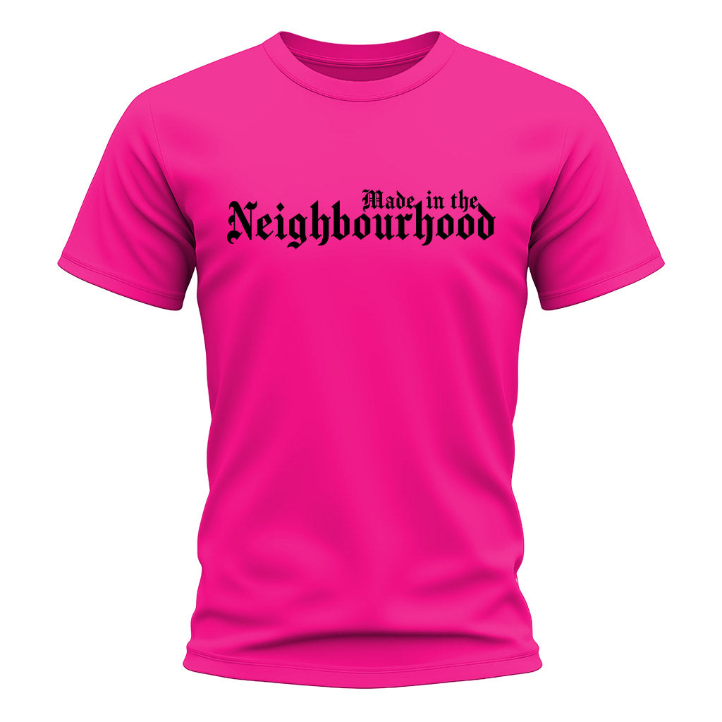 Pink t-shirt with 'Made in the Neighbourhood' text on a white background